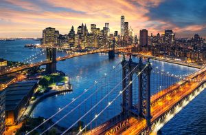 New York City - beautiful sunset over manhattan with manhattan and brooklyn bridge